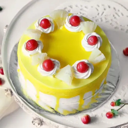 https://shoppingyatra.com/product_images/Pineapple Cake with Cherry Toppings (Half Kg)3.webp